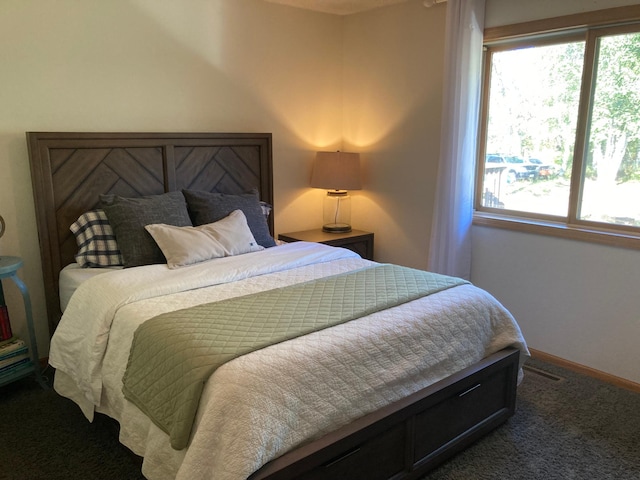 1496 Willard Lake Rd NW, Powers Twp, MN 56435 - bedroom featuring multiple windows, carpet, and baseboards