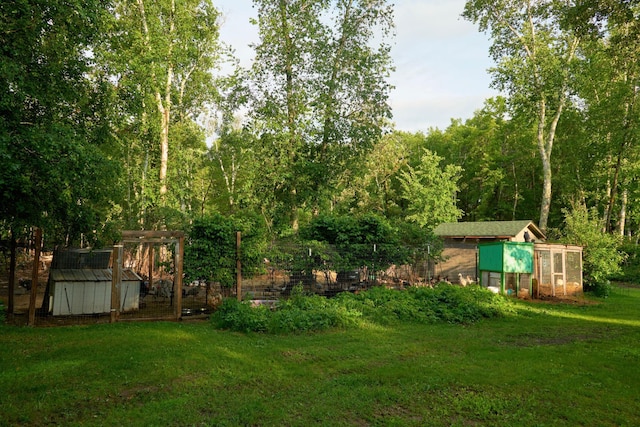 1496 Willard Lake Rd NW, Powers Twp, MN 56435 - view of grassy yard with exterior structure and an outbuilding