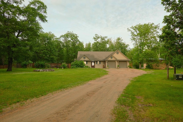 1496 Willard Lake Rd NW, Powers Twp, MN 56435 - ranch-style home with dirt driveway, an attached garage, and view of wooded area