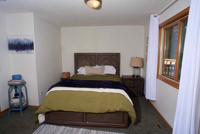 1496 Willard Lake Rd NW, Powers Twp, MN 56435 - carpeted bedroom featuring a textured ceiling and baseboards