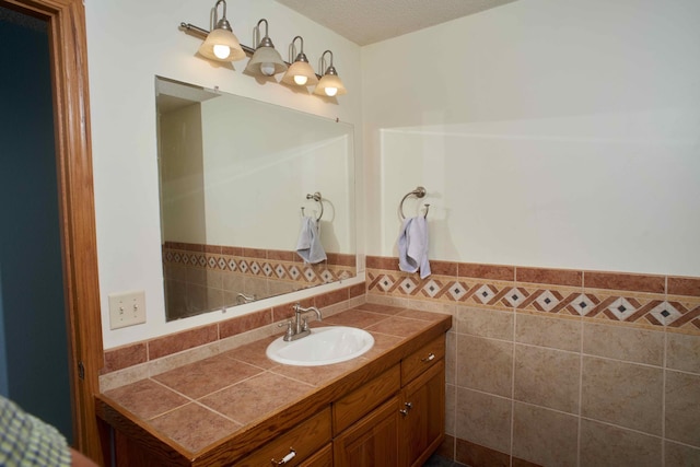 1496 Willard Lake Rd NW, Powers Twp, MN 56435 - bathroom featuring vanity and tile walls