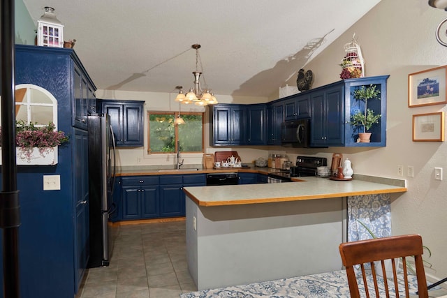 1496 Willard Lake Rd NW, Powers Twp, MN 56435 - kitchen with black appliances, blue cabinetry, a peninsula, light countertops, and a chandelier