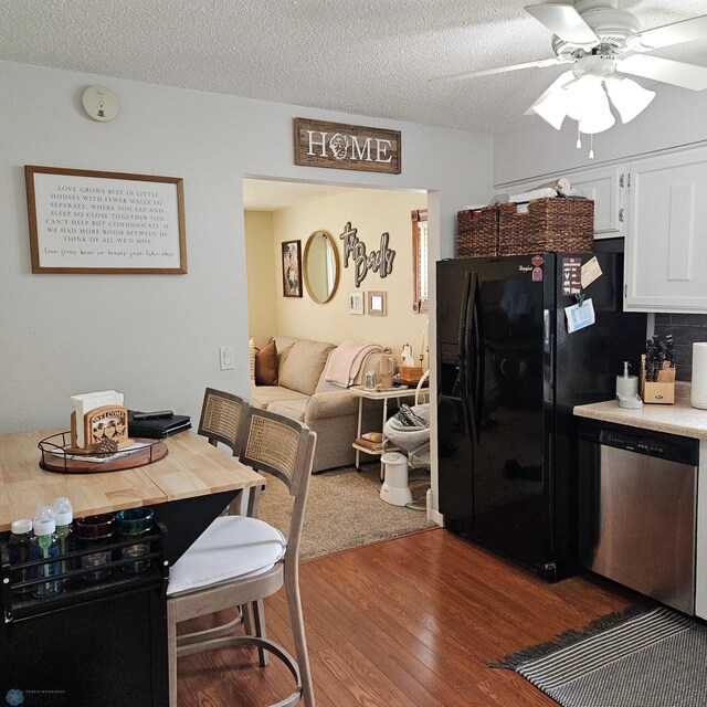 849 11th Ave W, West Fargo, ND 58078 - kitchen featuring dishwasher, wood finished floors, a ceiling fan, white cabinets, and black fridge with ice dispenser