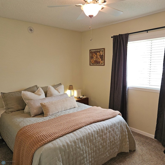 849 11th Ave W, West Fargo, ND 58078 - carpeted bedroom featuring a ceiling fan and baseboards