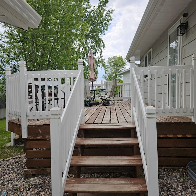 849 11th Ave W, West Fargo, ND 58078 - wooden deck featuring outdoor dining space and stairs