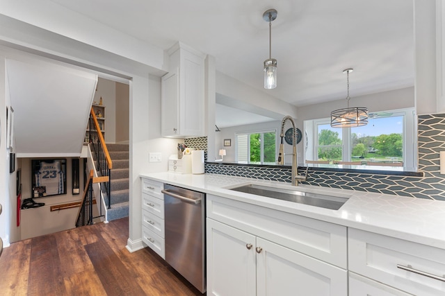 6813 Boudin St NE, Prior Lake, MN 55372 - kitchen featuring stainless steel dishwasher, decorative backsplash, dark wood-type flooring, and white cabinets