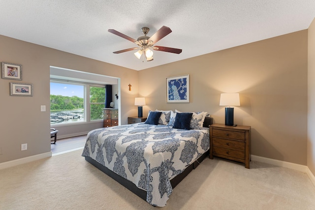 6813 Boudin St NE, Prior Lake, MN 55372 - bedroom featuring carpet flooring, a textured ceiling, and a ceiling fan