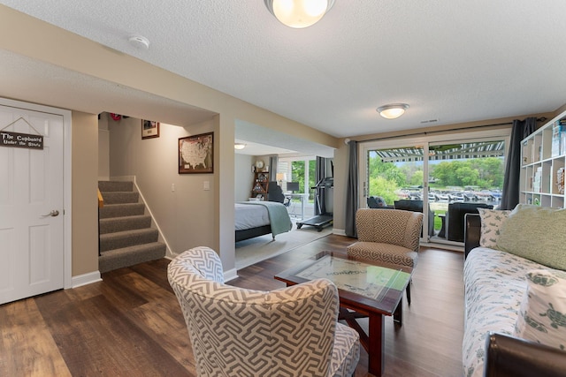 6813 Boudin St NE, Prior Lake, MN 55372 - living area with dark wood-type flooring, stairs, and a textured ceiling