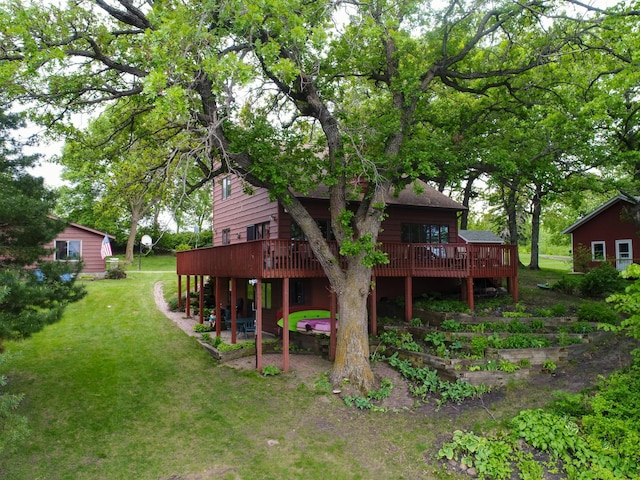 21534 275th Ave, Glenwood Twp, MN 56381 - rear view of property featuring a wooden deck, a lawn, and a patio area