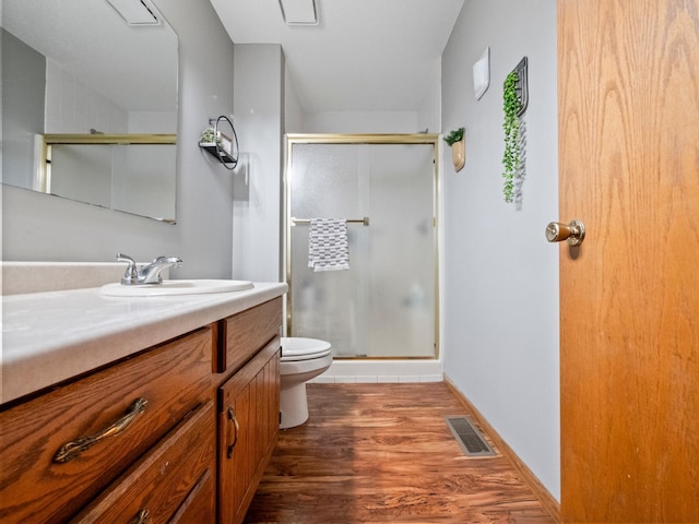 21534 275th Ave, Glenwood Twp, MN 56381 - bathroom featuring toilet, a stall shower, and vanity