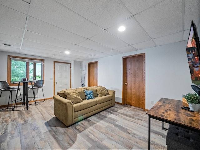 21534 275th Ave, Glenwood Twp, MN 56381 - living room with wood finished floors, baseboards, and a paneled ceiling