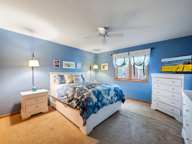 21534 275th Ave, Glenwood Twp, MN 56381 - carpeted bedroom featuring baseboards, a textured ceiling, and ceiling fan