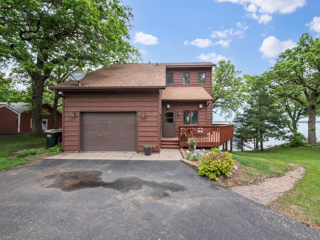 21534 275th Ave, Glenwood Twp, MN 56381 - rustic home with driveway, a wooden deck, roof with shingles, a front yard, and a garage