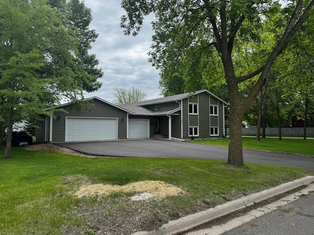 802 Estates Ave, Litchfield, MN 55355 - view of front of house with an attached garage and asphalt driveway