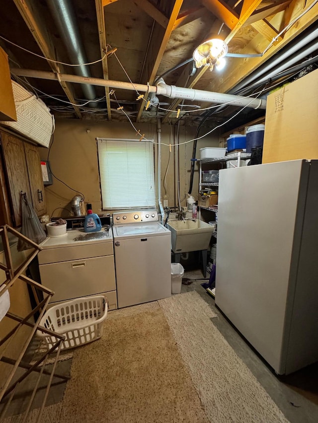 802 Estates Ave, Litchfield, MN 55355 - unfinished below grade area featuring freestanding refrigerator, independent washer and dryer, and a sink