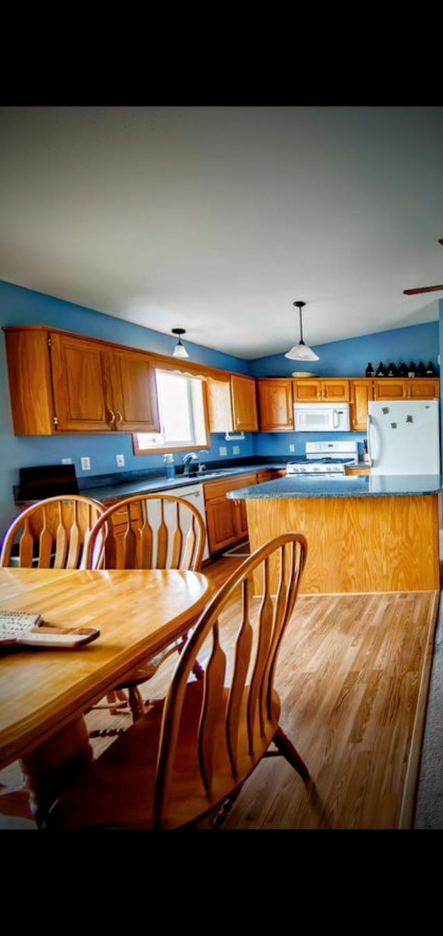 2030 Joes Lake Rd SE, Cambridge, MN 55008 - dining space featuring vaulted ceiling and wood finished floors