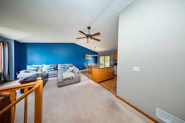 2030 Joes Lake Rd SE, Cambridge, MN 55008 - living area with a ceiling fan, light carpet, and lofted ceiling