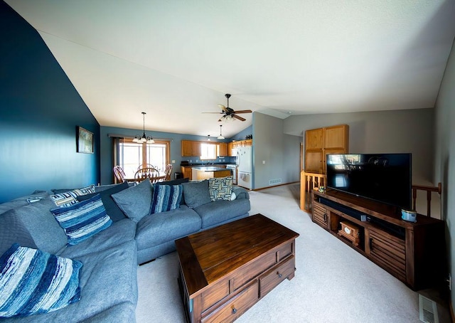 2030 Joes Lake Rd SE, Cambridge, MN 55008 - living area with vaulted ceiling, a chandelier, light colored carpet, and a ceiling fan