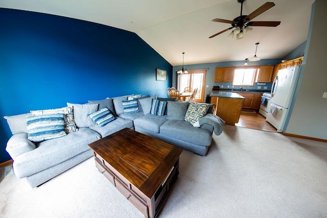 2030 Joes Lake Rd SE, Cambridge, MN 55008 - living room featuring lofted ceiling, ceiling fan, and light colored carpet