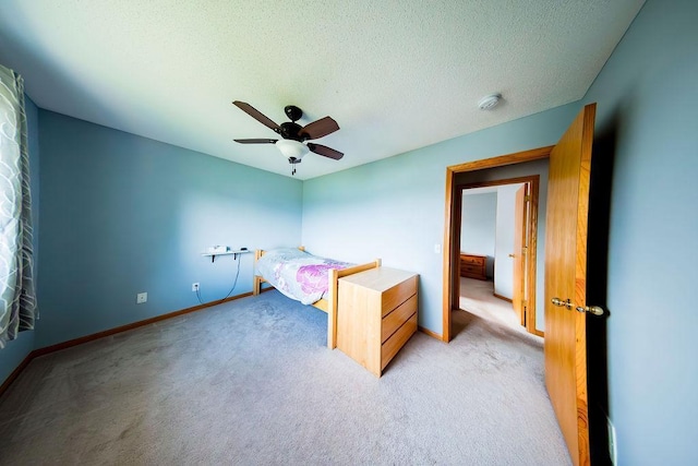 2030 Joes Lake Rd SE, Cambridge, MN 55008 - unfurnished bedroom with light colored carpet, a ceiling fan, and a textured ceiling