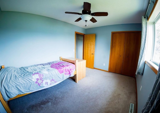 2030 Joes Lake Rd SE, Cambridge, MN 55008 - bedroom featuring carpet flooring, a closet, and ceiling fan