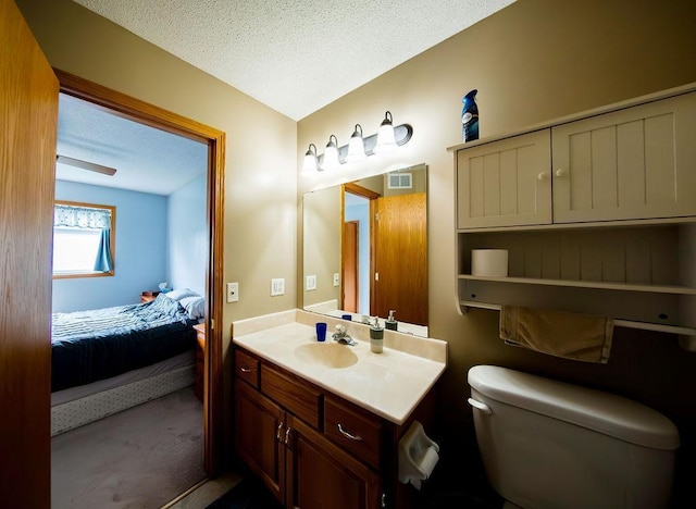 2030 Joes Lake Rd SE, Cambridge, MN 55008 - bathroom with vanity, ensuite bath, and a textured ceiling