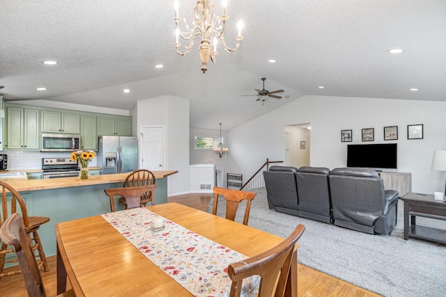 26821 Weston Ct, Elko New Market, MN 55020 - dining space featuring a chandelier, lofted ceiling, a textured ceiling, light wood-type flooring, and recessed lighting