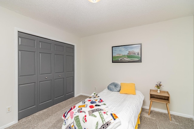26821 Weston Ct, Elko New Market, MN 55020 - bedroom with carpet floors, a closet, a textured ceiling, and baseboards