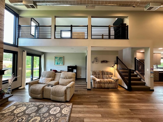 1953 Cecilee St, Worthington, MN 56187 - living area featuring stairway, wood-type flooring, and a high ceiling