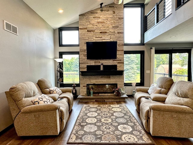 1953 Cecilee St, Worthington, MN 56187 - living area featuring high vaulted ceiling, wood-type flooring, and a fireplace