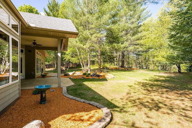 79394 Long Lake Rd, Kettle River Twp, MN 55795 - view of grassy yard featuring ceiling fan and a patio
