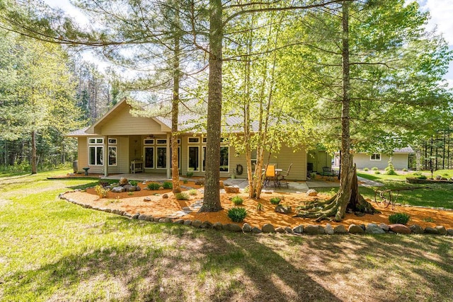 79394 Long Lake Rd, Kettle River Twp, MN 55795 - back of house with a patio area and a yard