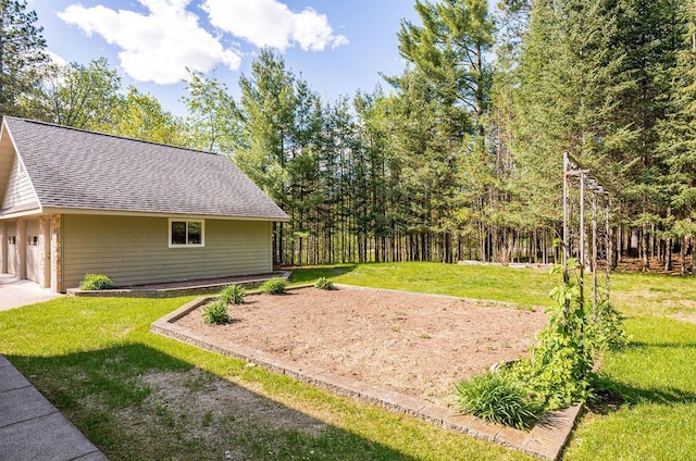 79394 Long Lake Rd, Kettle River Twp, MN 55795 - view of green lawn with a garage