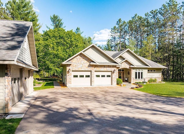 79394 Long Lake Rd, Kettle River Twp, MN 55795 - craftsman-style home with stone siding, driveway, and a front yard