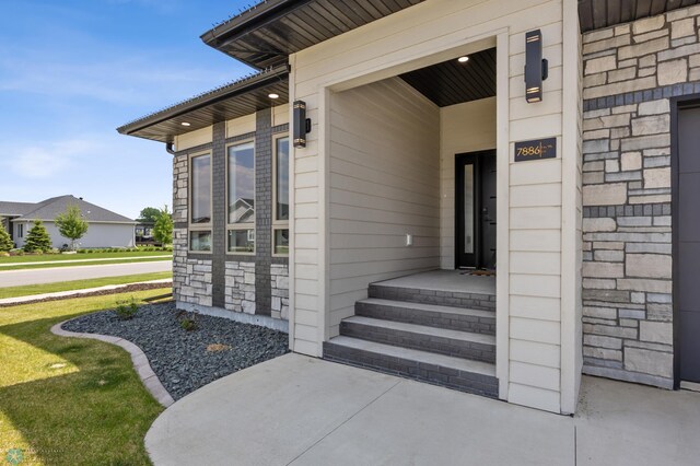7886 Firefly Ln, Horace, ND 58047 - doorway to property featuring stone siding