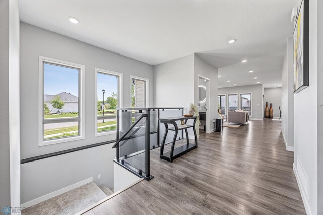 7886 Firefly Ln, Horace, ND 58047 - hallway with an upstairs landing, baseboards, dark wood finished floors, and recessed lighting