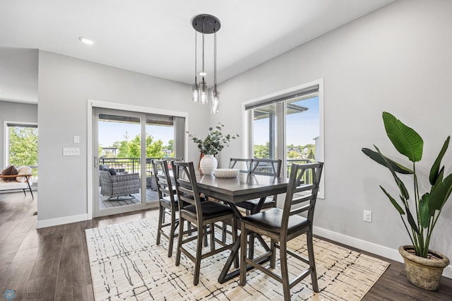 7886 Firefly Ln, Horace, ND 58047 - dining area with healthy amount of natural light, baseboards, wood finished floors, and recessed lighting