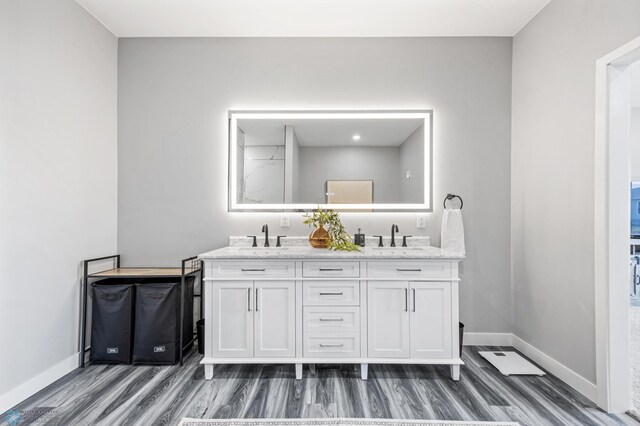 7886 Firefly Ln, Horace, ND 58047 - full bathroom with double vanity, wood finished floors, and baseboards