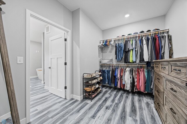 7886 Firefly Ln, Horace, ND 58047 - walk in closet featuring wood finished floors