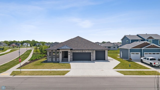 7886 Firefly Ln, Horace, ND 58047 - view of front facade featuring an attached garage, concrete driveway, a residential view, and a front yard