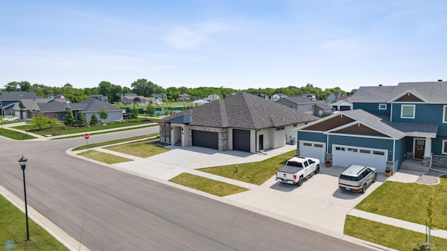 7886 Firefly Ln, Horace, ND 58047 - view of front of house featuring stone siding, a residential view, and an attached garage