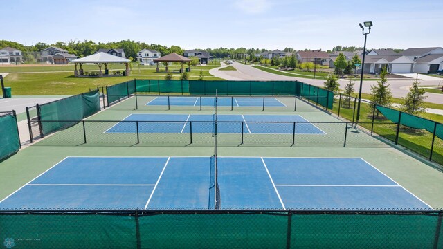 7886 Firefly Ln, Horace, ND 58047 - view of tennis court with a gazebo, a residential view, and community basketball court