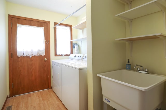 308 18th Ave NE, Waseca, MN 56093 - laundry area featuring washer and dryer and light wood finished floors