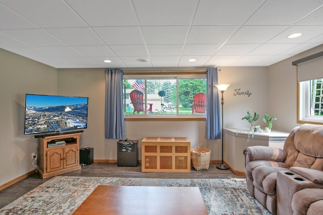 308 18th Ave NE, Waseca, MN 56093 - living area featuring baseboards, a drop ceiling, and recessed lighting