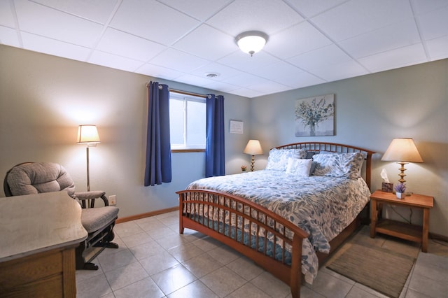308 18th Ave NE, Waseca, MN 56093 - bedroom with a drop ceiling, baseboards, and tile patterned flooring