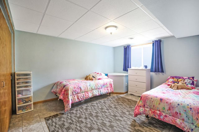 308 18th Ave NE, Waseca, MN 56093 - bedroom with a drop ceiling and baseboards