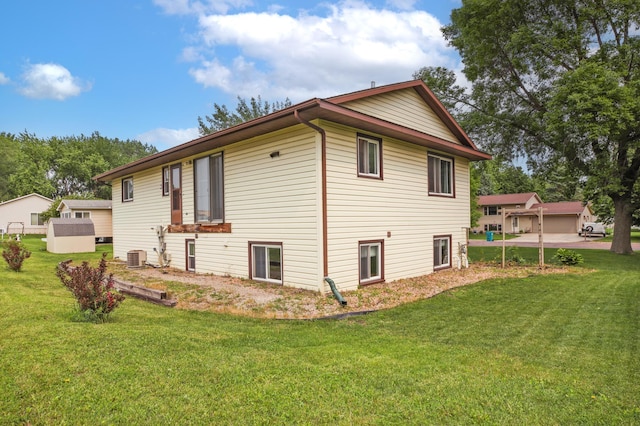 308 18th Ave NE, Waseca, MN 56093 - view of property exterior with a lawn and central AC unit