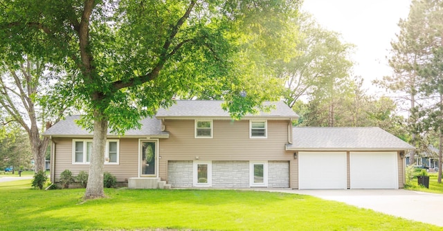 801 Riverside Ave N, Sartell, MN 56377 - split level home featuring a garage, concrete driveway, a front yard, and a shingled roof