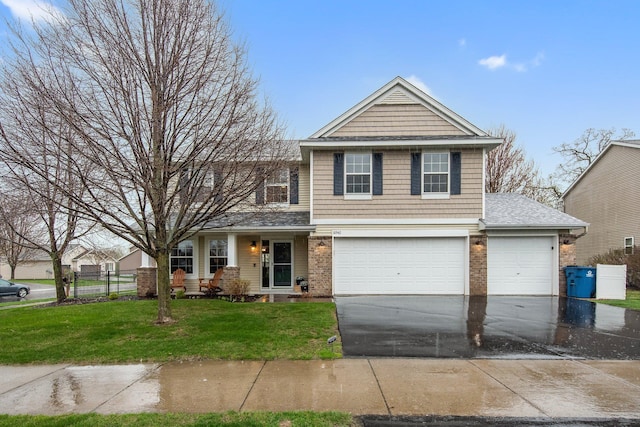10542 188th Ave NW, Elk River, MN 55330 - view of front of home featuring driveway, brick siding, a garage, and roof with shingles
