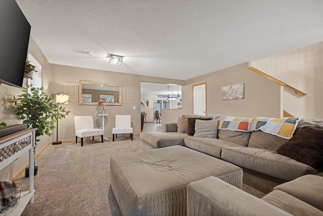 10542 188th Ave NW, Elk River, MN 55330 - carpeted living area with a chandelier and baseboards
